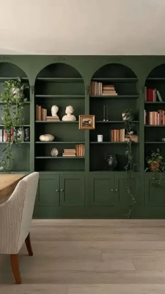 dark curved bookshelf living room forest green charcoal moody dramatic statement 2026
