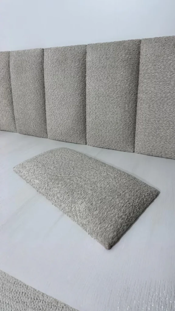 bouclé headboard bedroom close up fabric texture soft lighting