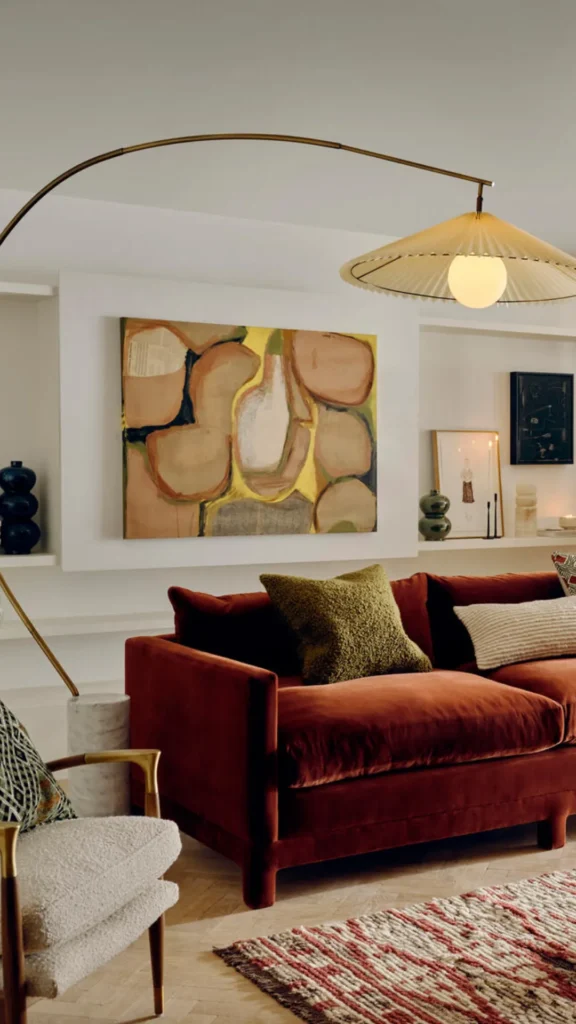 how to style curved sofa arched floor lamp sculptural echoing silhouette