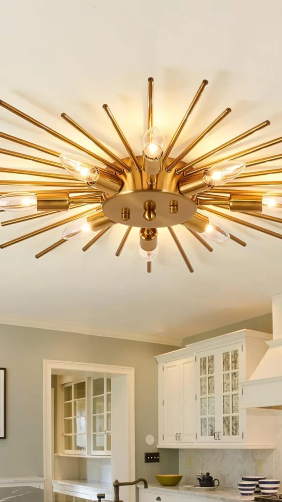 living room decor trends 2026 warm metal finishes brass bronze chrome