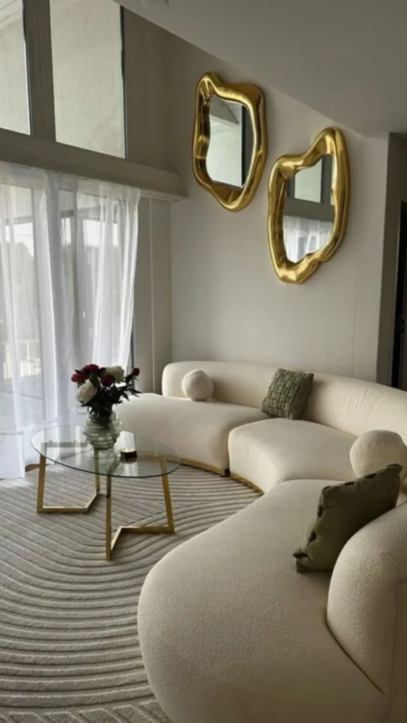 how to style curved sofa softening angular modern space contrast