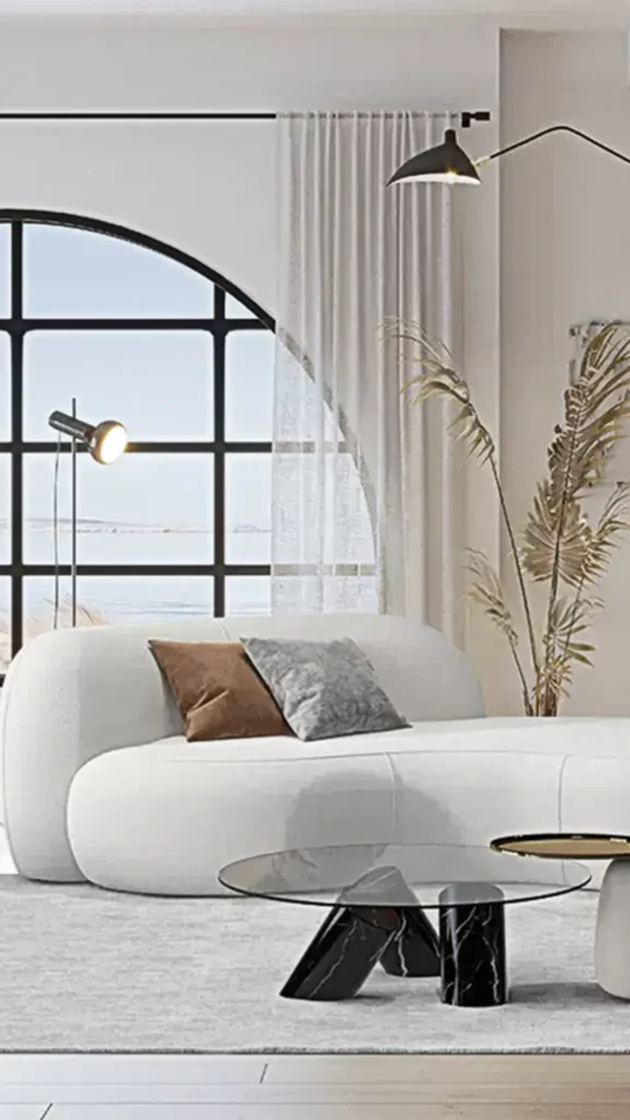 how to style curved sofa layered textural cushions boucle linen velvet