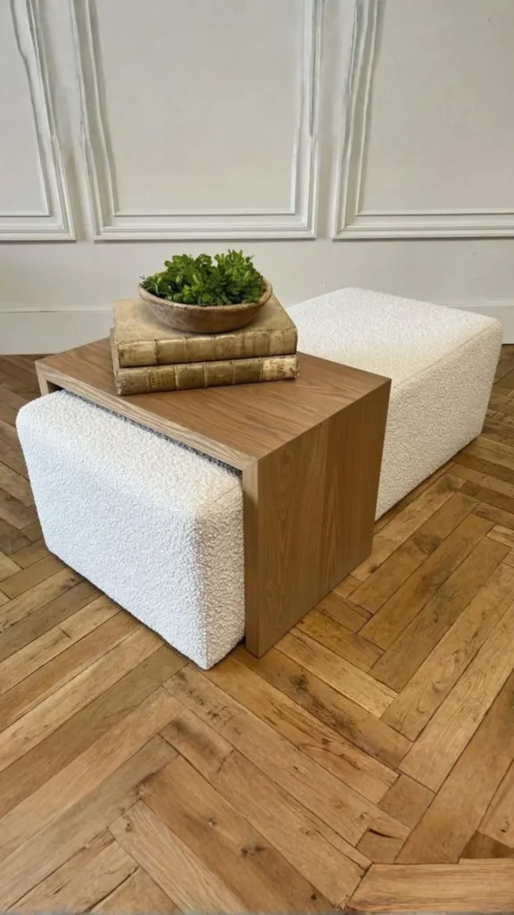 boucle ottoman beautifully styled wooden tray books candle warm living room 2026