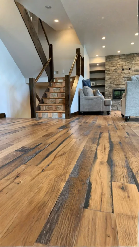 modern farmhouse living room wide plank wood flooring warm natural 2026