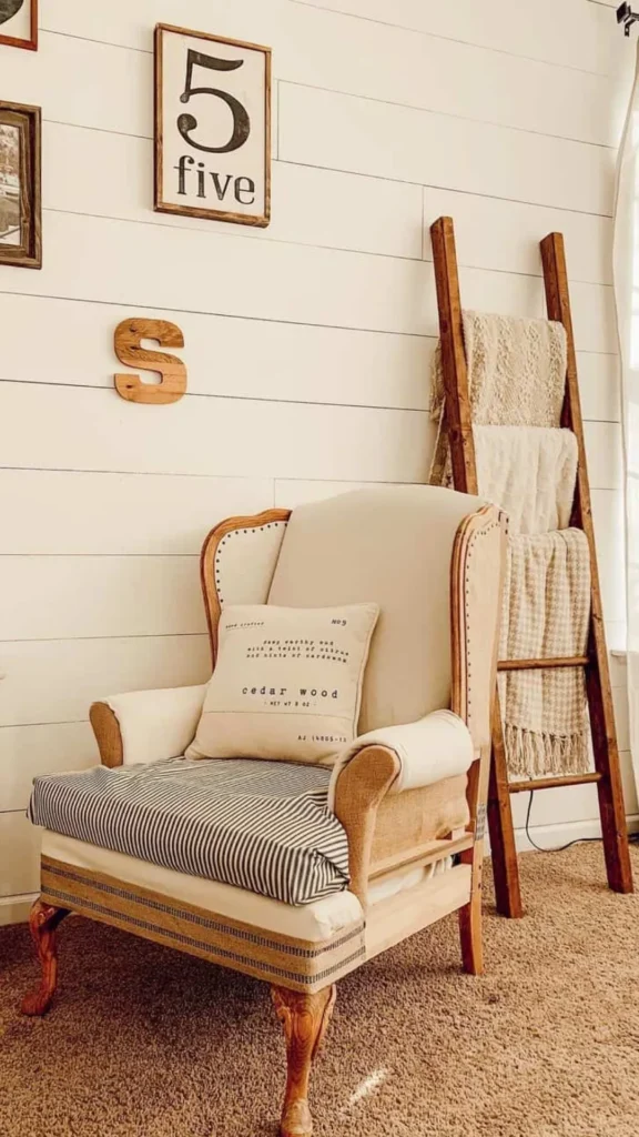 neutral living room ideas vintage armchair anchoring room 2026