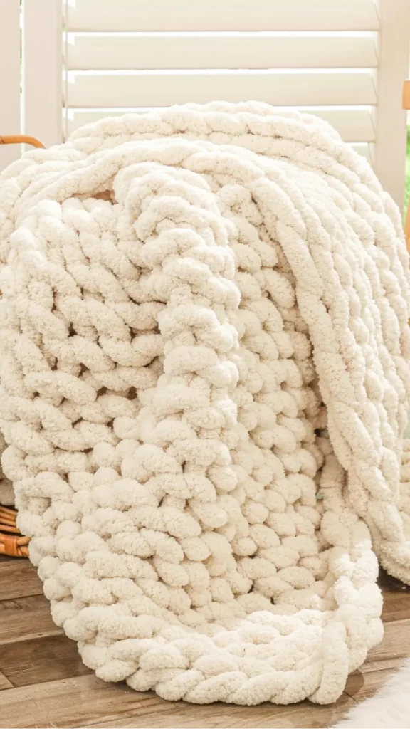 natural textures organic modern living room chunky knit wool throw smooth linen sofa arm 2026