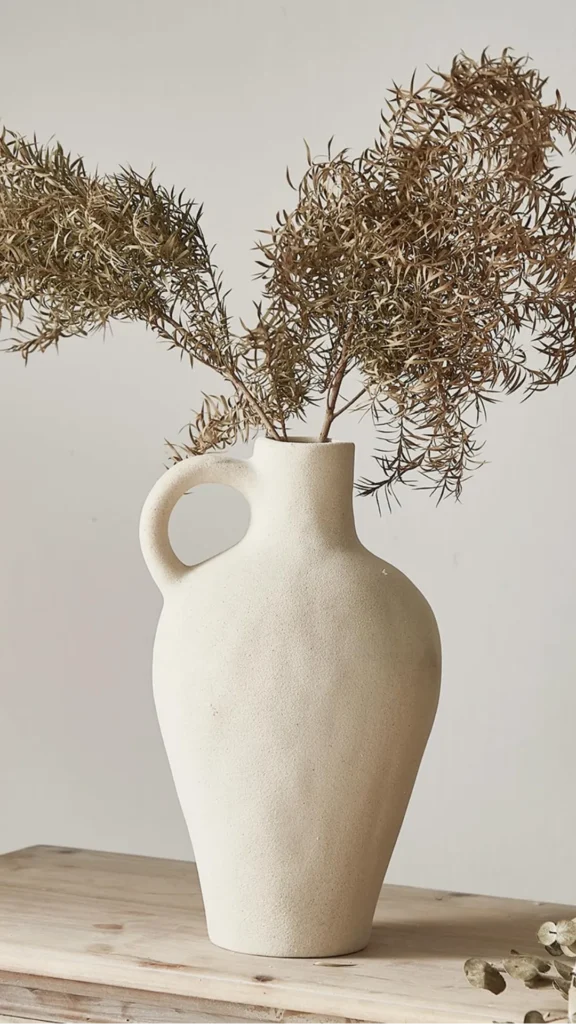 natural textures organic modern living room handmade earthy ceramic vase dried botanical warm wood shelf 2026