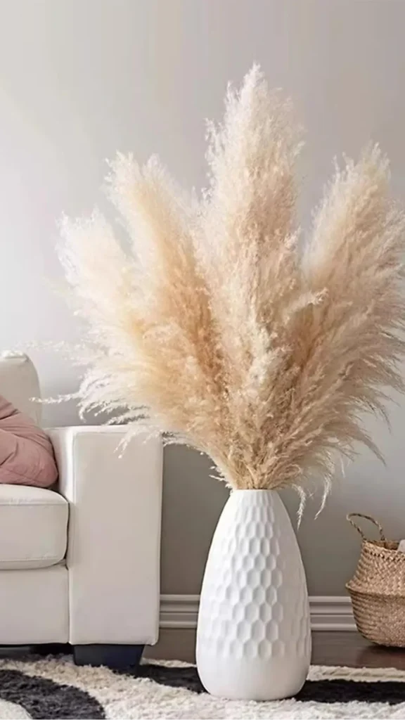 natural textures organic modern living room cream bouclé cushion tall ceramic dried pampas grass 2026