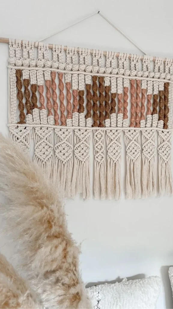 boho living room ideas large macramé wall hanging statement wall feature warm 2026