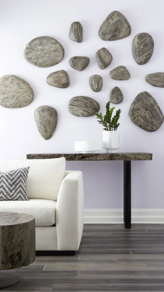 wabi-sabi objects organic modern home smooth dark river stone decorative object warm wood desk 2026