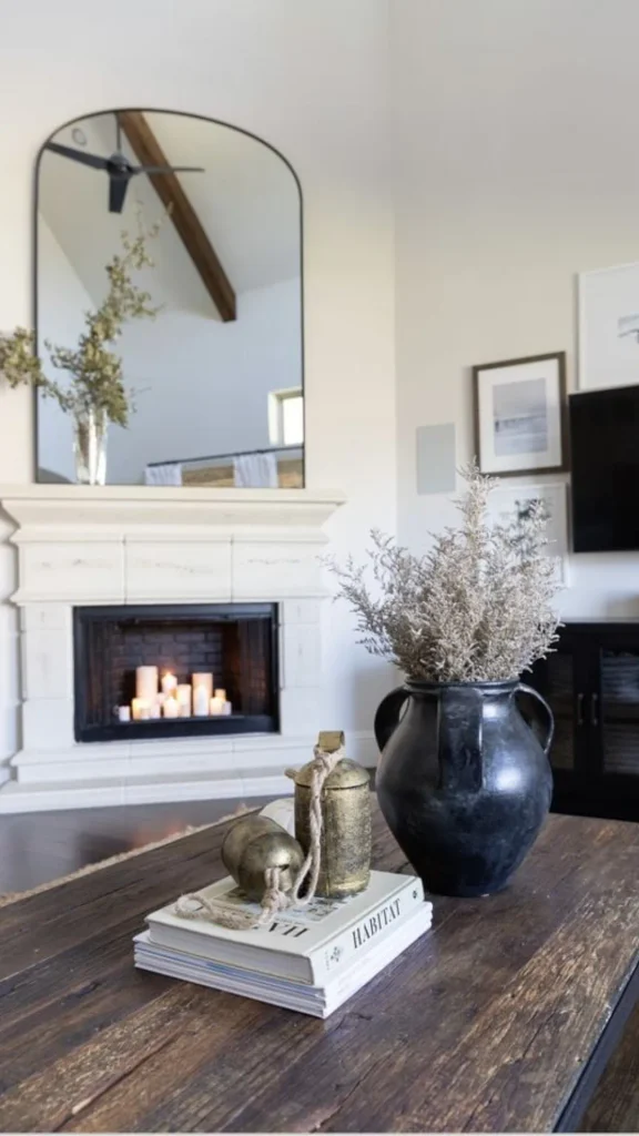 curved mirror ideas arch mirror above stone fireplace 2026