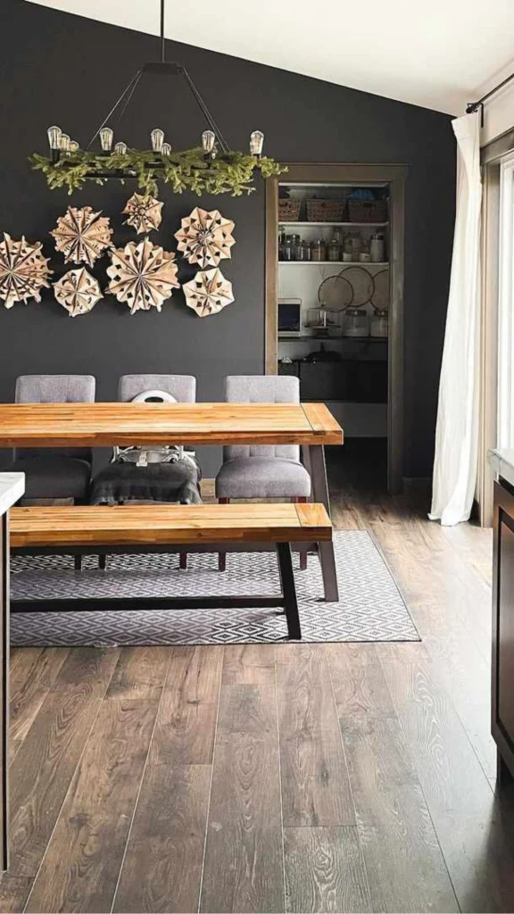black accent wall ideas dining room warm wood table 2026