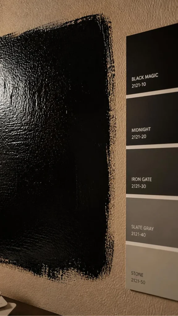 black accent wall ideas paint sample tested before commitment 2026